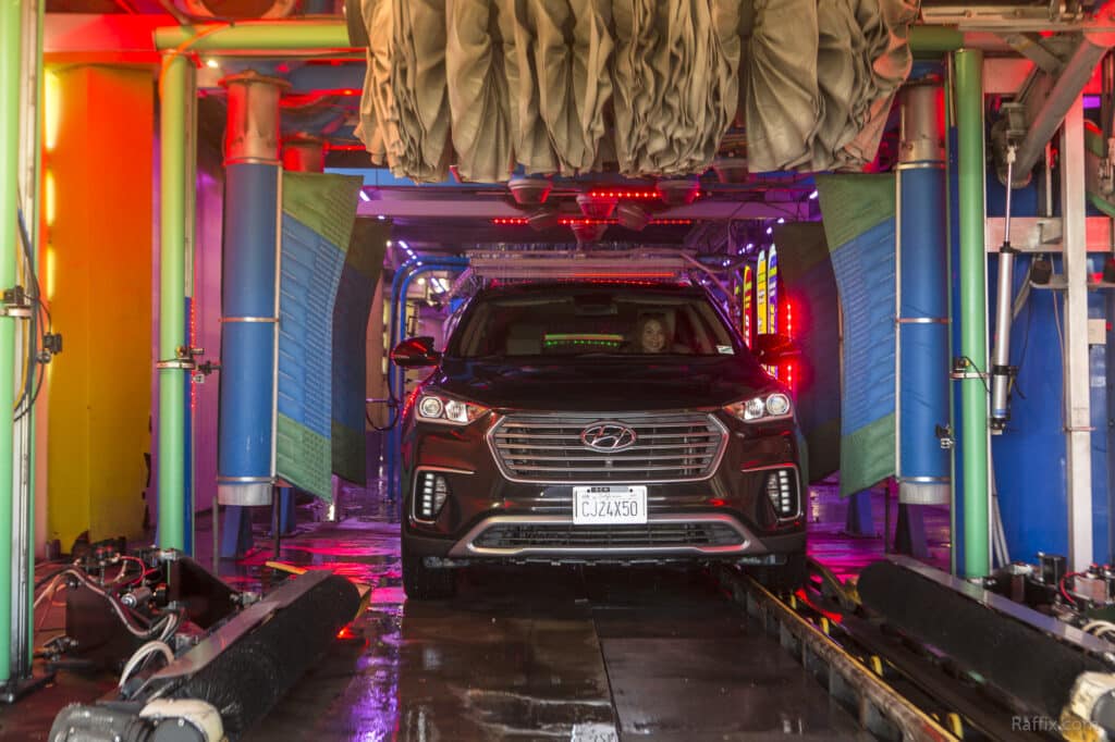 Vehicle washed in illuminated tunnel through a Speedwash car wash location in California