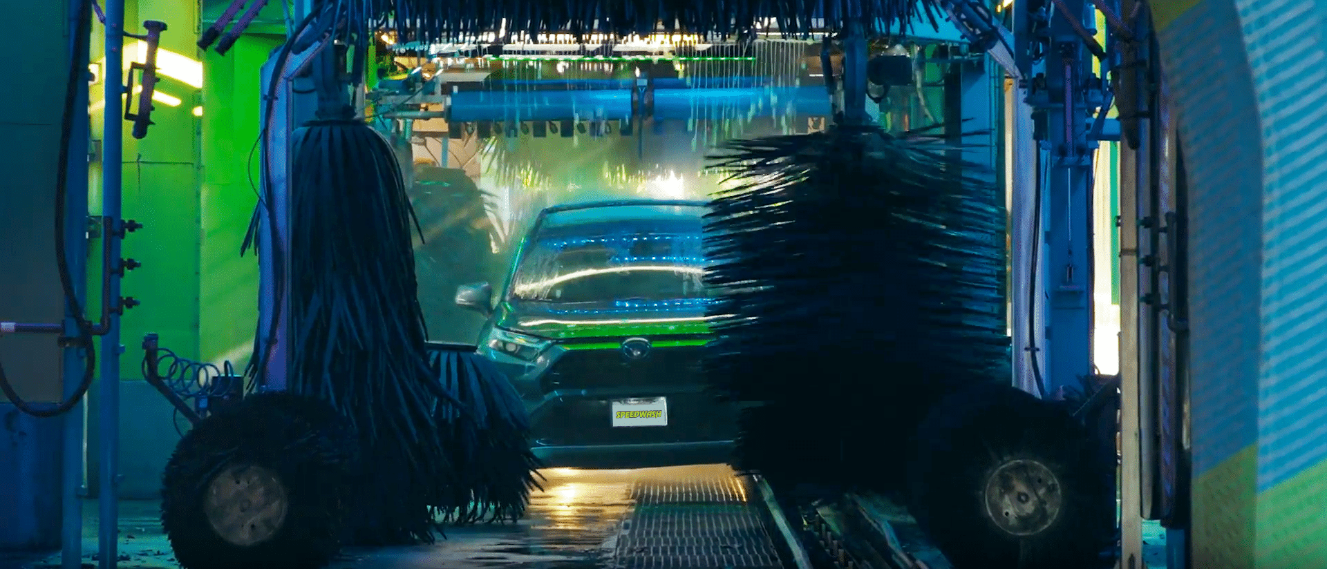 Vehicle in car wash tunnel